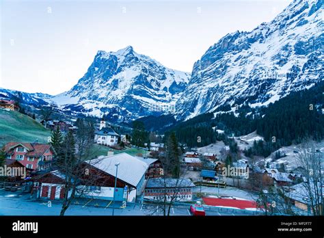 View Of Grindelwald Village In The Snowy Valley Of The Alps Mountain In