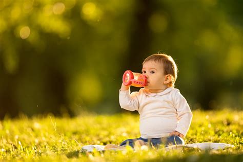 Baby Drinking Juice Stock Photo Download Image Now Baby Human Age