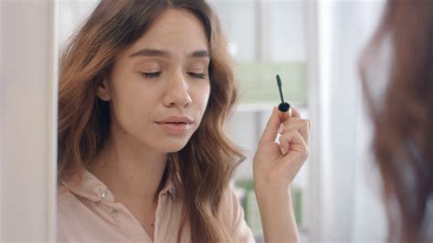 Beautiful Woman Using Mascara For Eyelashes Front Bathroom Mirror