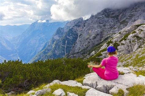 Active Woman Exercising In The Nature Above The Beautiful Valley Stock