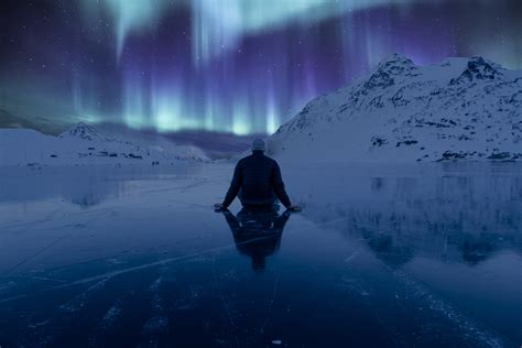 Man Sitting On Frosted Lake Watching Norther Aurora Lights Hd Wallpaper