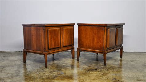 The top has previously been refinished to cover a loss of a patch of veneer, as can be seen in the pictures. SELECT MODERN: Pair of Broyhill Forward '70 Nightstands, Cabinets or Bedside, End or Side Tables