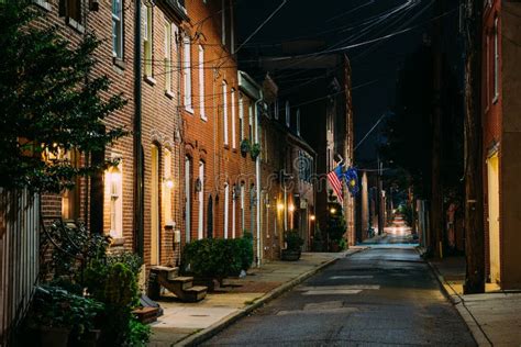 American Flag And Row Houses On Bethel Street At Night In Fells Point