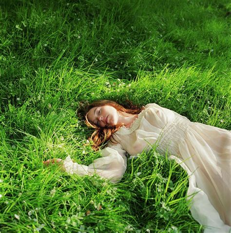 Woman In Dress Lying Down On Grass Photograph By Lisa Kimmell