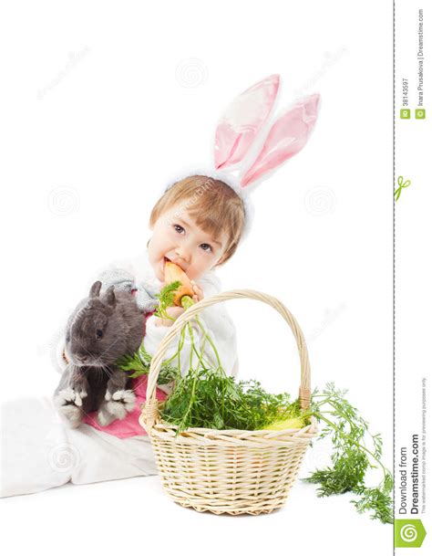 Baby In Easter Bunny Costume Eating Carrot Kid Girl Rabbit Hare Stock