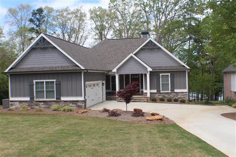 Board & batten single 8 and cedar impressions double 7 staggered perfection in cypress are a perfect complement to the overall look of this home. Front elevation showing board and batten siding, stone ...