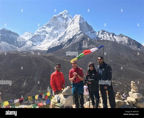 Members Of Team Whiteman Stand Over The Mountains On The Mount Everest