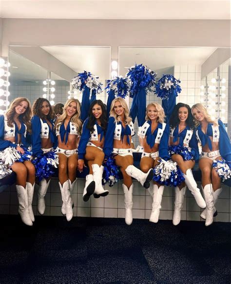 A Group Of Cheerleaders Posing For A Photo In Front Of A Bathroom Mirror