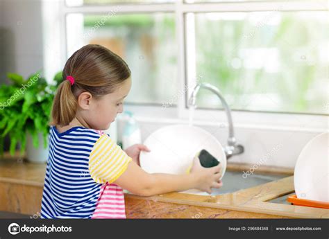 Child Washing Dishes Stock Photo By ©famveldman 296484348