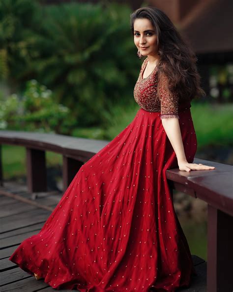 Actress Bhama In Red Long Dress 003