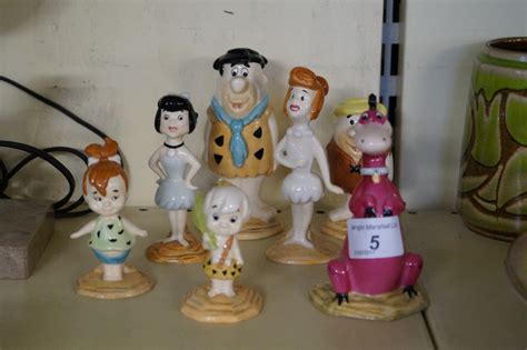 A Beswick Ceramic Flintstone Set To Include Fred Wilma Betty Rubble