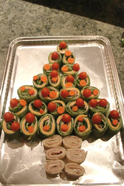 Garnish with chopped red and green bell peppers for extra holiday flare. The Nesting Corral: Christmas Tree Roll-ups