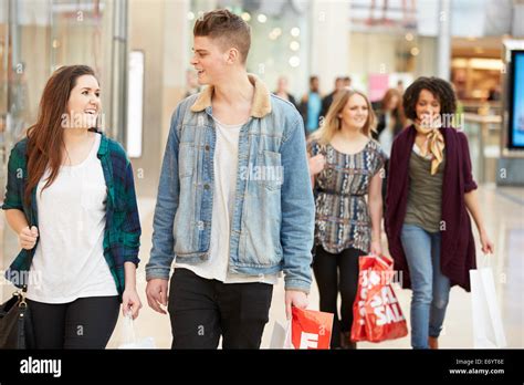 Group Of Young Friends Shopping In Mall Together Stock Photo Alamy