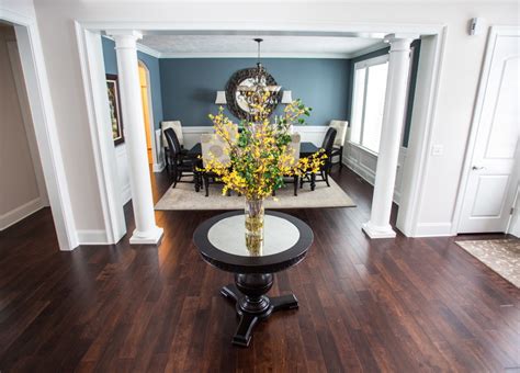Any dining room update calls for a beautiful chandelier. Chic round foyer table in Dining Room Transitional with ...