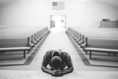 Man Praying At Altar