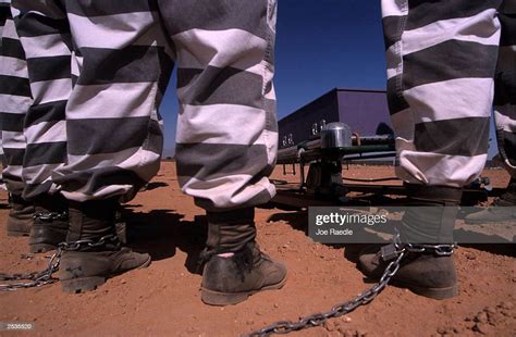 Female Jail Inmates Are Chained Together As They Bury Cadavers At