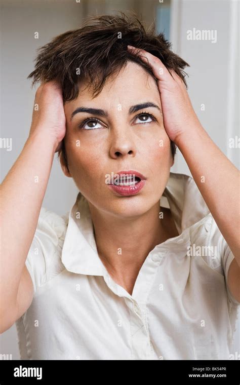 One Woman Hold Head 40s Sick Hi Res Stock Photography And Images Alamy