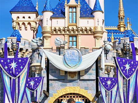 first look sleeping beauty castle shimmering overlay celebrates disney 100 years of wonder