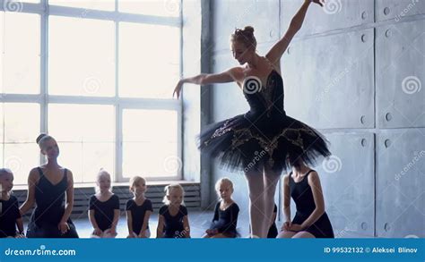 Girl Dancer In Ballet School Learns To Dance Little Ballerina In Training In Black Dancing Suit