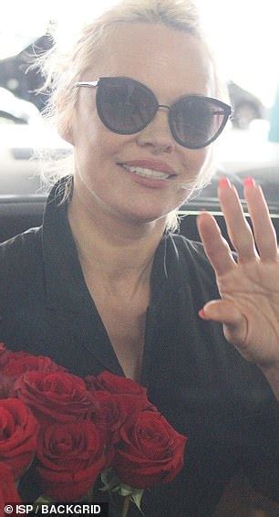 Pamela Anderson Makes A Chic Arrival In A Black Jumpsuit Daily Mail