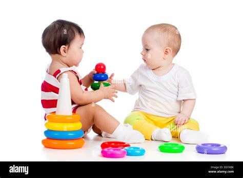 Two Babies Girls Playing Together With Color Toys Stock Photo Alamy