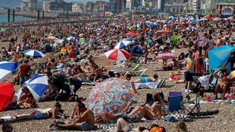 beach crowds descend on bournemouth brighton and poole bbc news