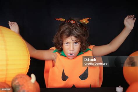 Cute Kid In Halloween Costume Scaring Pose Stock Photo Download Image