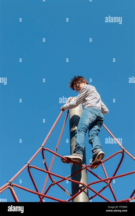 Boy Climbing Ropes Stock Photo Alamy