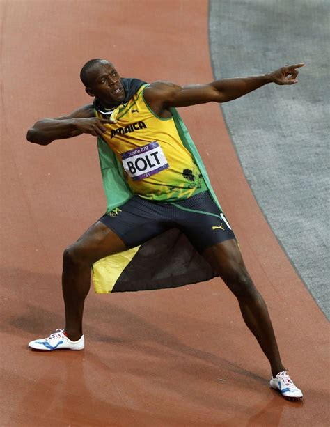 usain bolt defends olympic gold photos of world s fastest man on the track ibtimes india