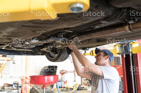 Auto Repair Garage With Mechanic Stock Photo - Download Image Now - iStock