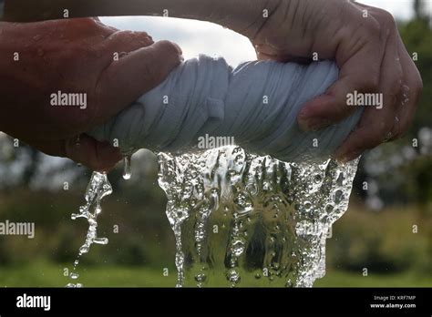 Hands Squeeze Wet Cloth Stock Photo Alamy