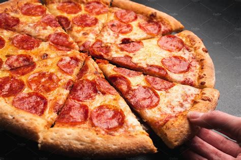 Taking slice of pepperoni pizza | High-Quality Food Images ~ Creative ...