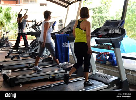 4 Women Walking On Treadmills In Medellin Gym Stock Photo Alamy