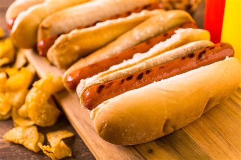 Premium Photo Grilled Hot Dogs On A White Hot Dog Buns With Chips And