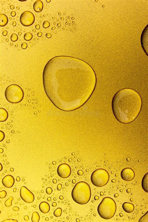 Vertical Water Drop On Gold Texture Background Water Droplet On Gold