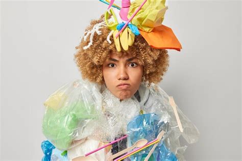 Premium Photo Irritated Curly Haired Woman Poses With Plastic Garbage