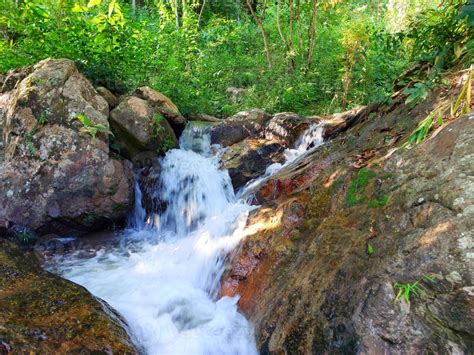 Jungle Waterfall Cascade In Tropical Rainforest With Rock And Turquoise