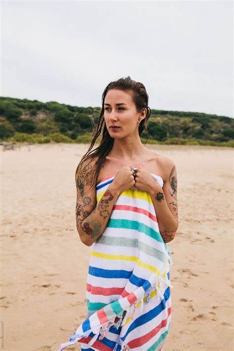 Beautiful Woman Wrapped In A Towel After Swimming By Kkgas Stocksy United