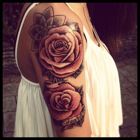 Cat tattoos are perfect for anyone wanting to tap into their feline energy. Red cute rose tattoo on shoulder