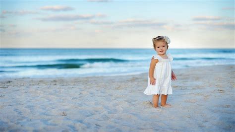 Girl Standing On The Beach During Daytime Hd Wallpaper Wallpaper Flare