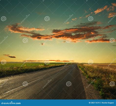 Lonely Road Leading To The Horizon At Sunset Sky Stock Photo Image Of