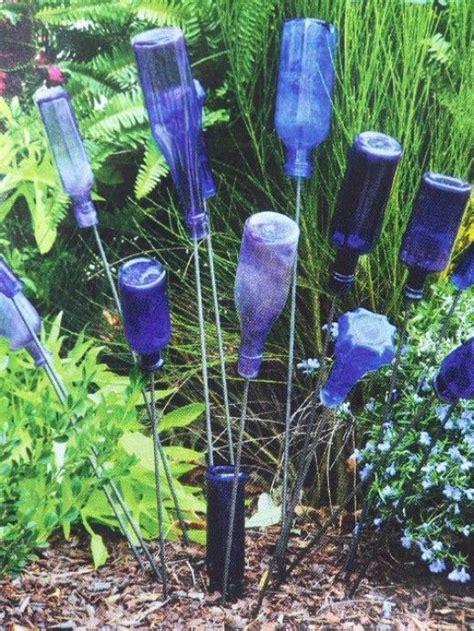 diy how to make a bottle tree for your garden bottle garden glass garden art wine bottle trees