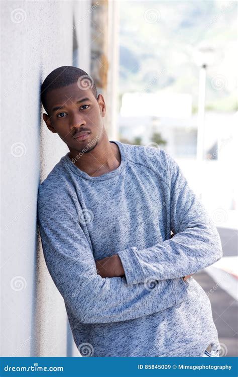 Portrait Of Young Black Man Leaning Against Wall Stock Image Image Of