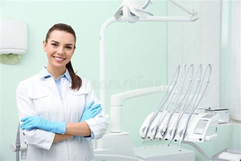 Young Female Dentist In White Coat At Workplace Stock Photo Image Of
