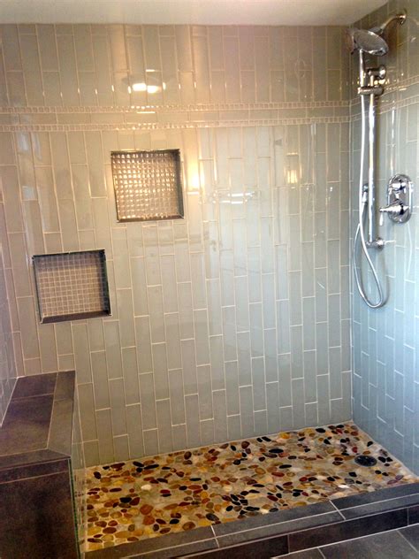 This is a short video on how i grout river rocks on a shower floor. Glass subway tile shower, glass mosaic niches, flat stone ...