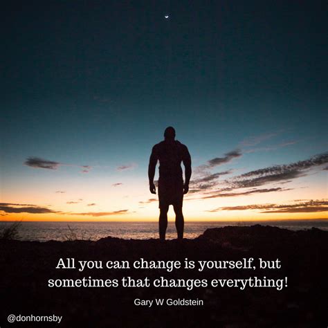 A Man Standing On Top Of A Hill Next To The Ocean At Sunset With A