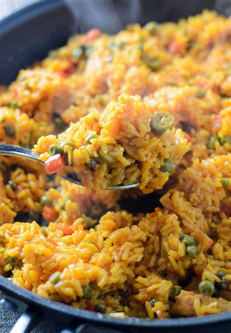 Bright and spicy and comforting! Easy Arroz Con Pollo is a Latin American chicken and rice ...