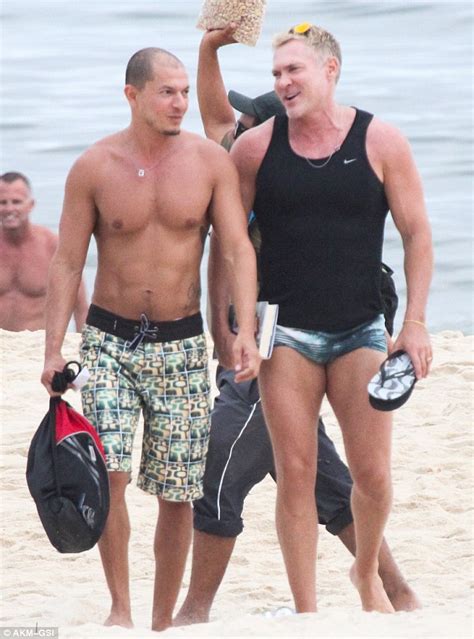Sam Champion Flaunts His Buff Body On Brazilian Beach Alongside