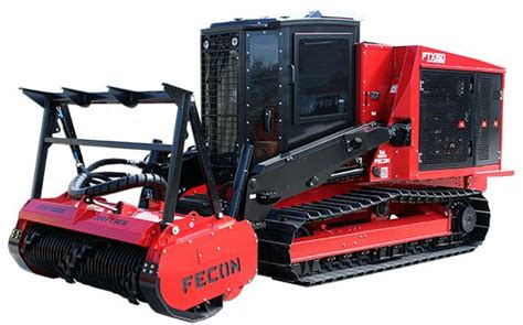 A Red Tractor Parked Next To A Black Machine On Top Of A White