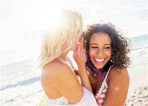 Female Friends On Beach Stock Photo Dissolve